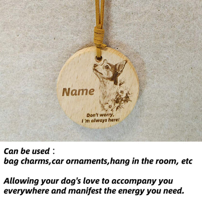 Chihuahua wooden pendant used as a [car hang/bag charm] in a lifestyle setting.