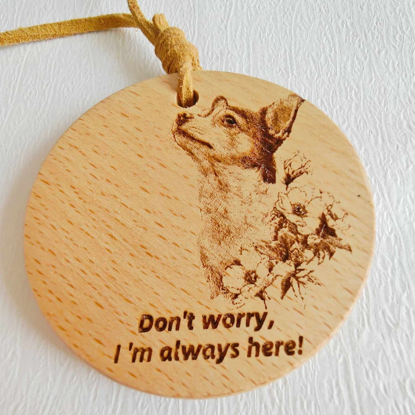 Close-up of the Chihuahua love design on the wooden pendant with inspirational quote.