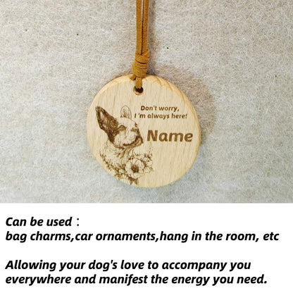 French Bulldog wooden pendant used as a [car hang/bag charm] in a lifestyle setting.
